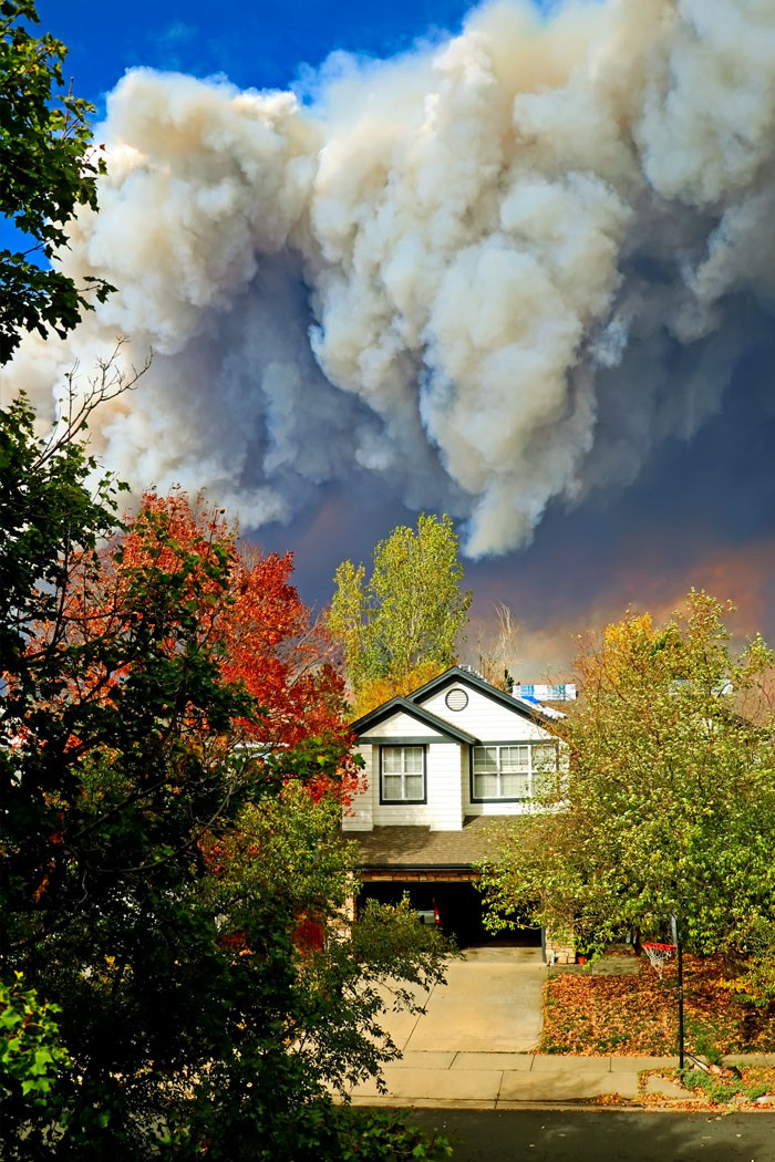 House in danger by incoming wildfire